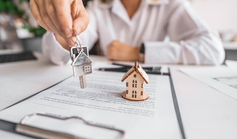 Buyer receiving keys after completing a home purchase