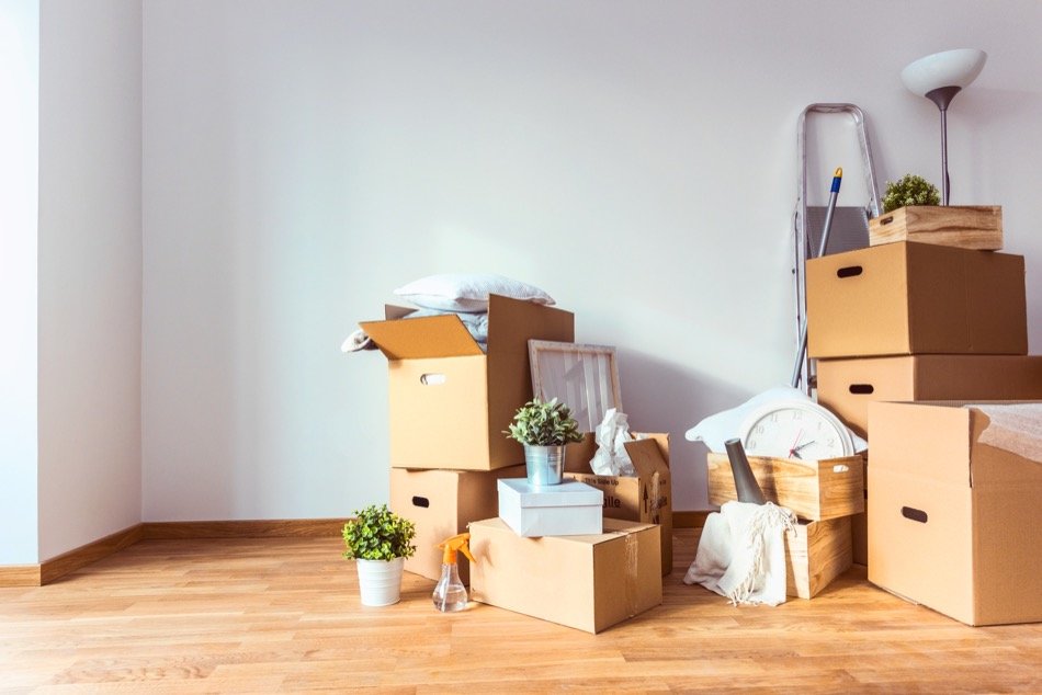 Moving boxes and household items being organized before a move
