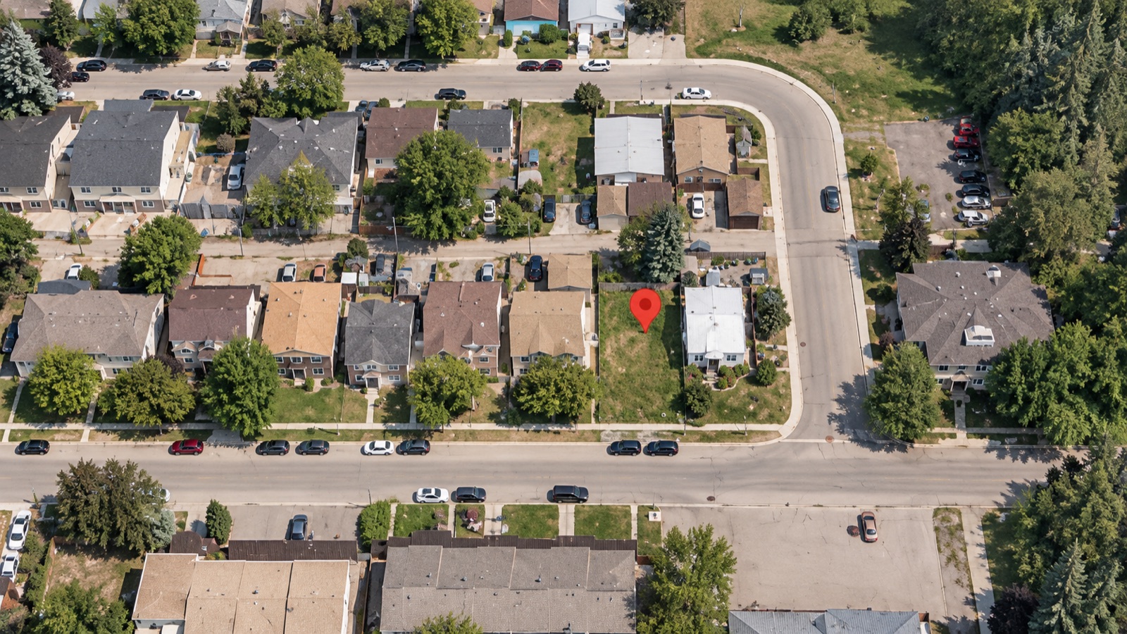 Aerial view showing the vacant lot within the surrounding High River neighbourhood